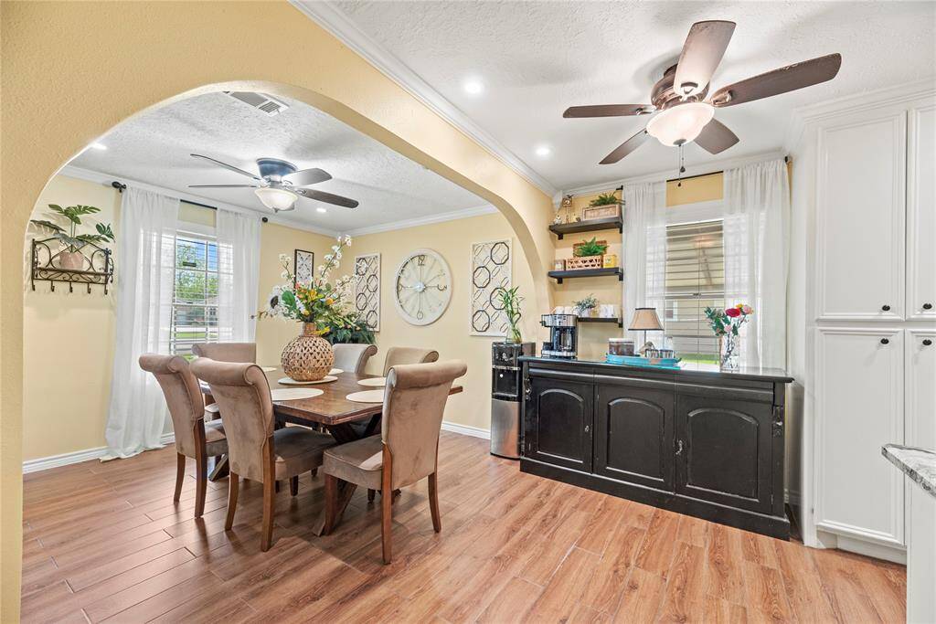 Connected to the kitchen, this elegant dining space offers room for hosting plus enough space for a coffee station!