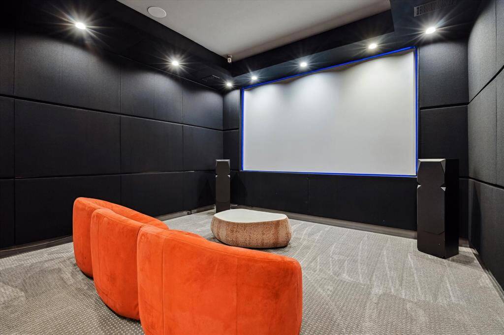 Designed for the ultimate cinematic experience at home, this fully acoustically treated custom theater features 135'' screen, projector, and Dolby Atmos acoustics.