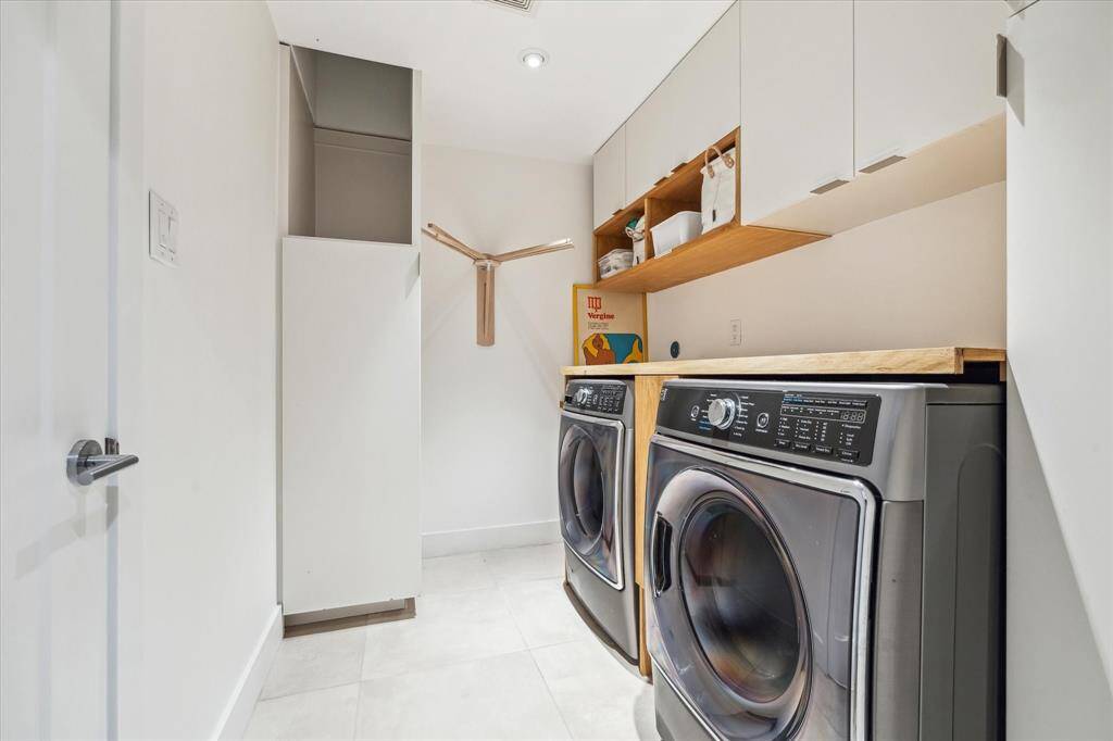 Instead of lugging it down the stairs, drop your laundry through the chute from the second floor. In addition to being located on the first floor away from the entertaining spaces, the laundry room has secondary access through the primary closet.
