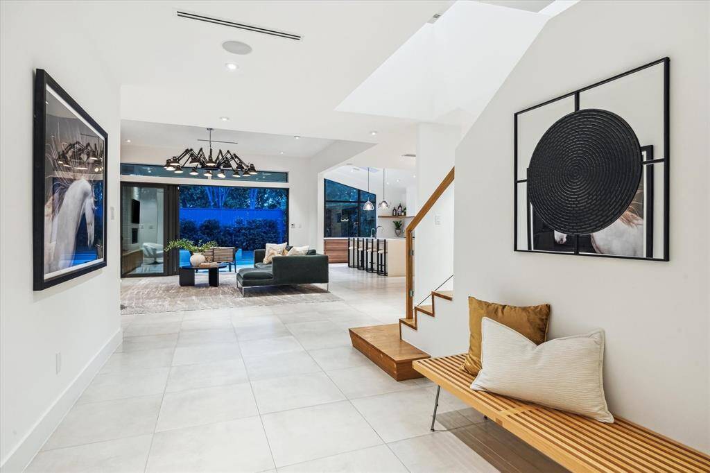 With natural light pouring in through large windows, the open and airy floor plan has a warm and inviting atmosphere throughout.