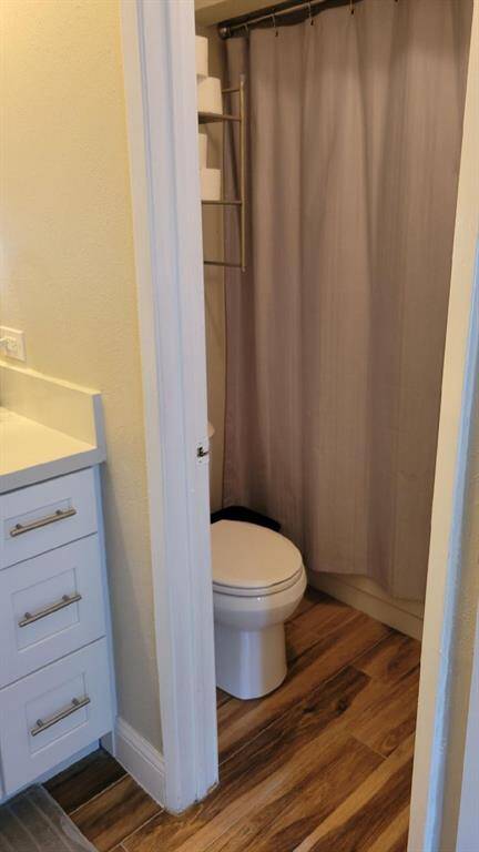The primary bathroom features a tub and shower combo.