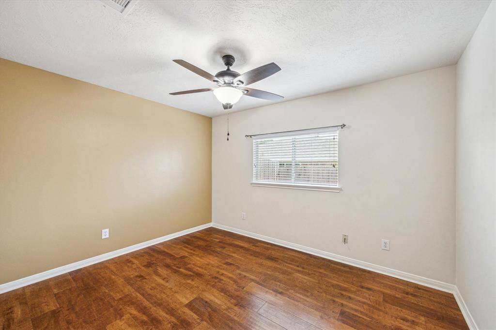 Bedroom 2 has engineered wood flooring.