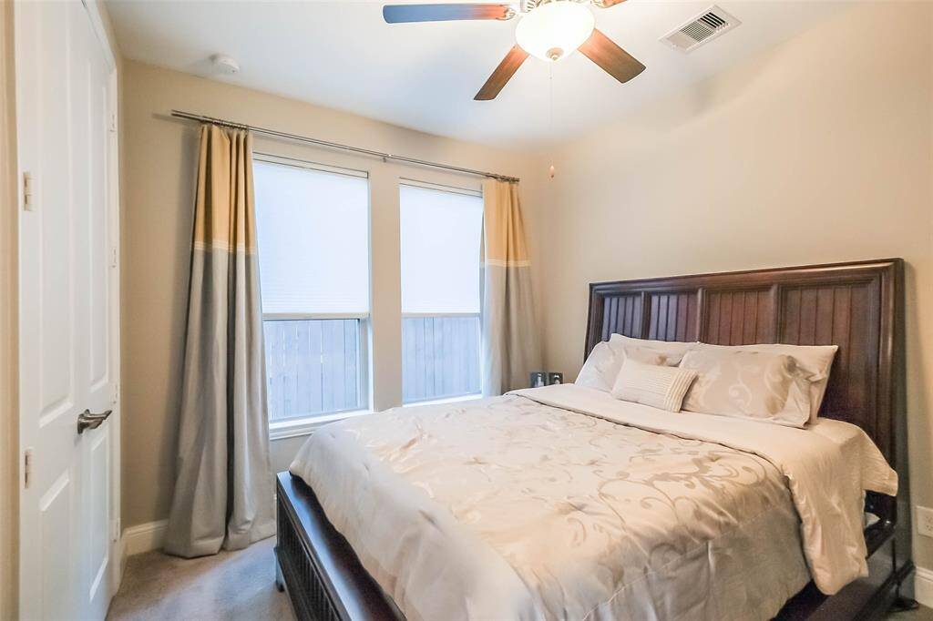 Guest suite bedroom with ceiling fan