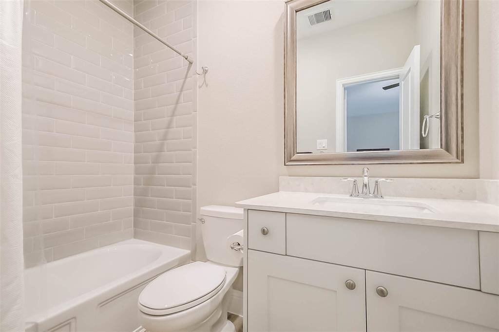 Ensuite upstairs bathroom–all with quartz counters and framed mirrors!