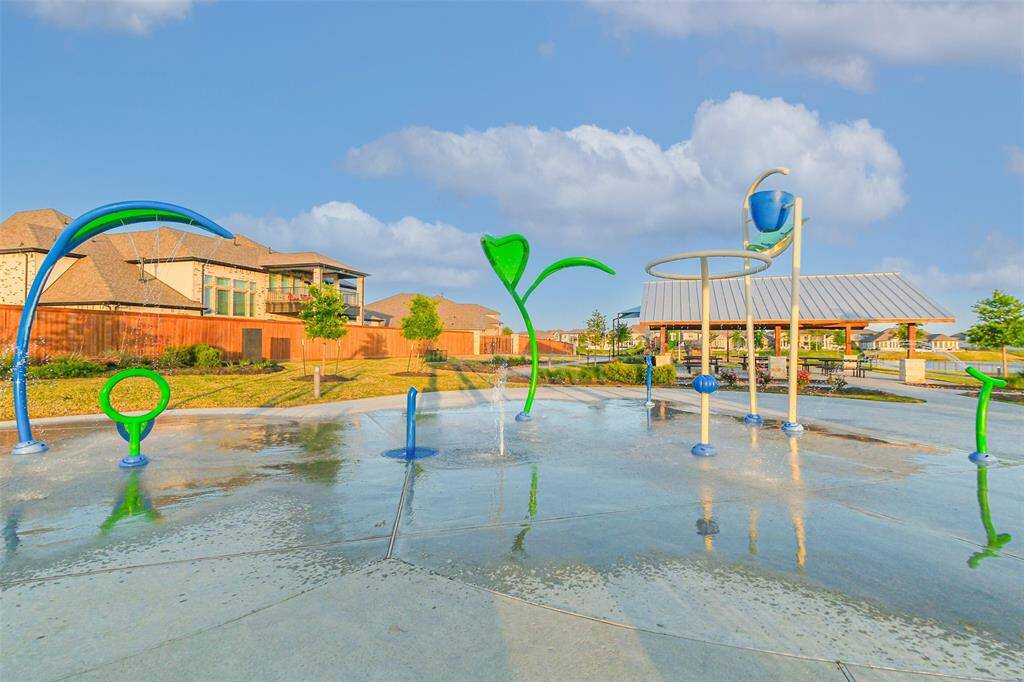 The splash pad at Marina Bay Park is one of Towne Lake’s many play areas and is walking distance from the house.