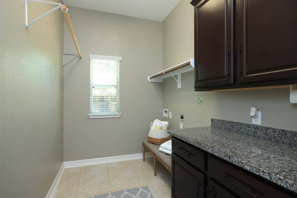 Laundry room with plenty of storage and counters