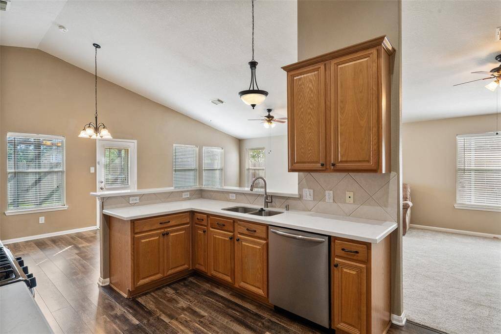 This kitchen offers abundant cabinet space plus a large pantry. With its open layout and seamless flow into the family room and dining area, you'll stay connected whether you're cooking up weeknight meals or hosting guests.