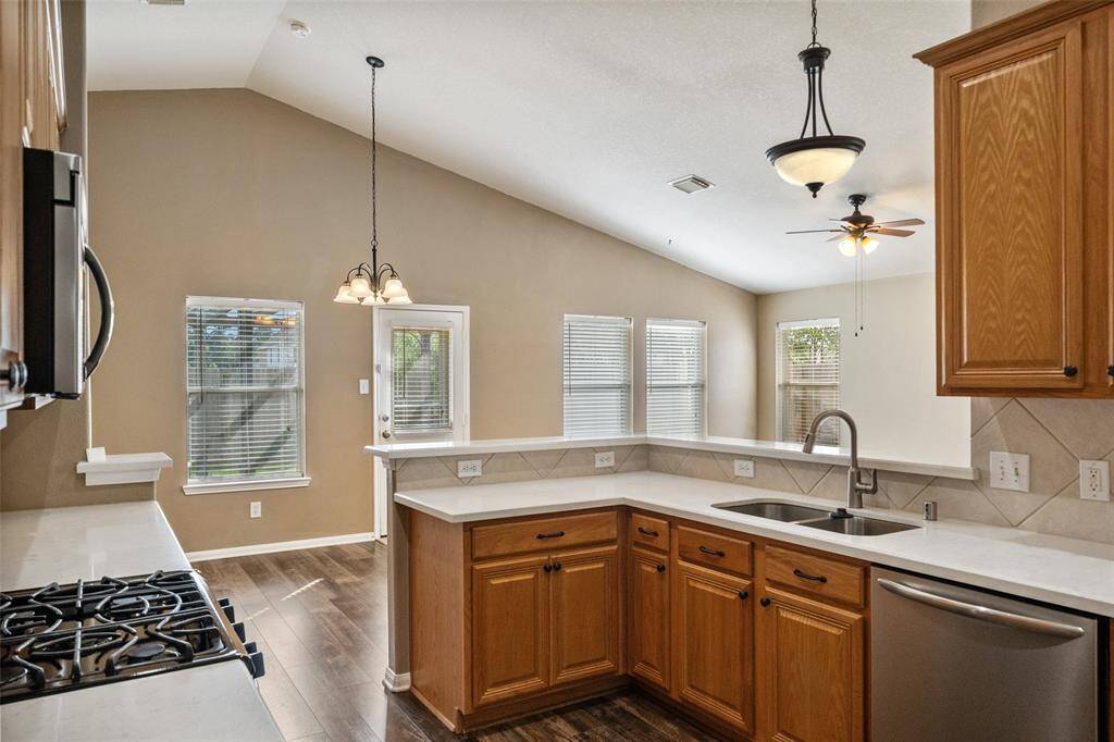 You may be inspired to entertain more often with a kitchen like this! Featuring a large pantry, tons of cabinetry and counter space, and an open layout that flows effortlessly into the family room and dining area. It's designed for everything from laid-back meals to hosting a full house.