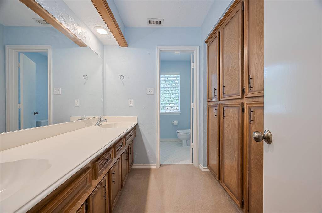 18015 Mountfield is situated on a peaceful cul-de-sac, offering a tranquil setting. A long and extra-wide driveway leads to a detached 2-car garage, with plenty of space for additional parking or guests. This layout ensures ample room for both residents and visitors.