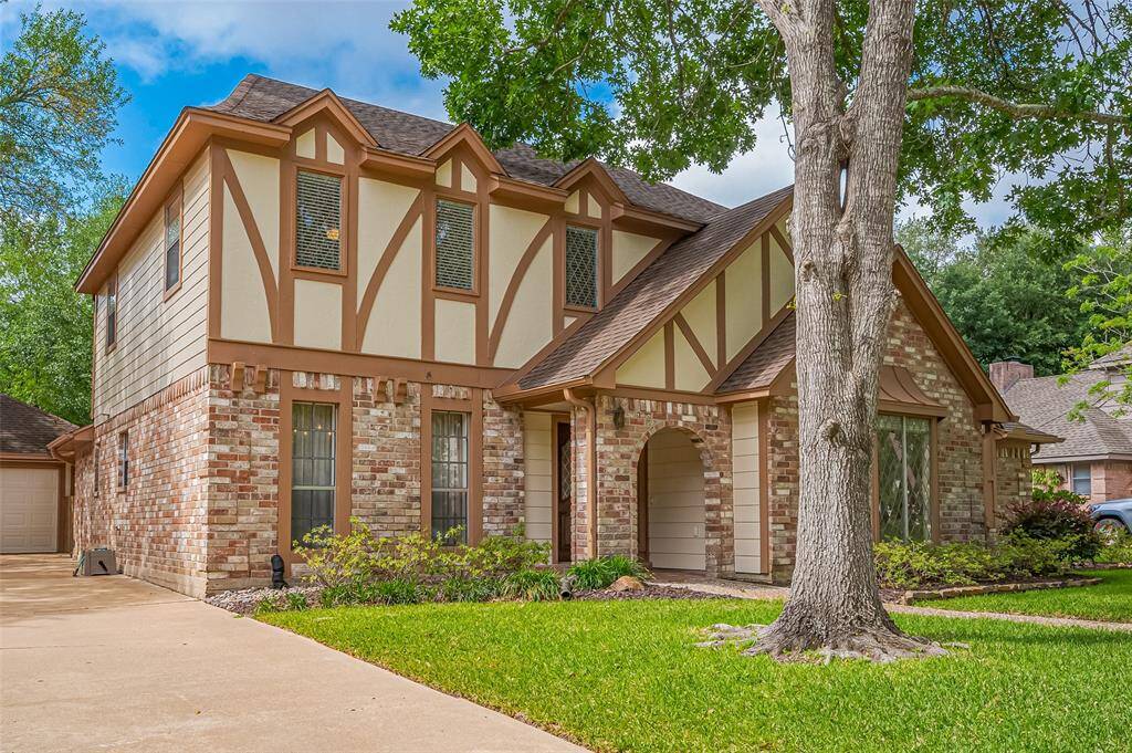 The two-car detached garage sits at the rear of the lot, offering both privacy and convenience. Equipped with a garage door opener, it provides easy access. A breezeway connects the house and garage, creating a sheltered path between the two, perfect for rainy days or carrying groceries inside.