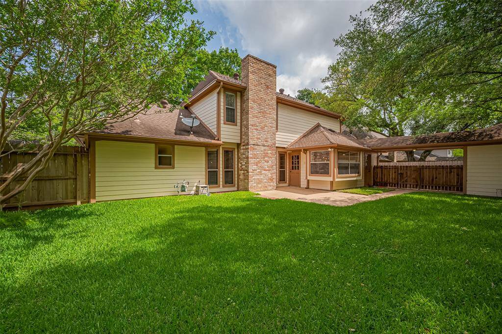 A gorgeous live oak tree canopies the backyard, offering generous shade and creating a serene, park-like setting. It’s the perfect spot to unwind with a book, watch the kids play, or simply enjoy the peaceful rustle of leaves overhead on a breezy afternoon.