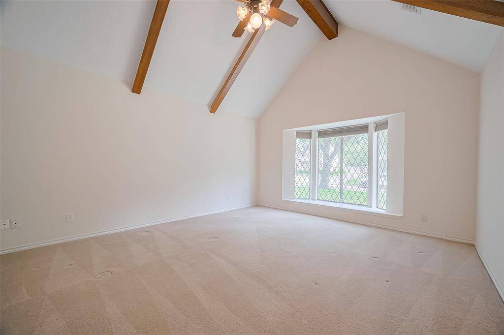 This large room features a leaded glass bay window that offers a stunning view of the front yard—ideal for displaying a Christmas tree during the holidays. The window fills the room with natural light, especially if used as a home office, where you can keep an eye on deliveries throughout the day. With ample wall space for bookshelves, an entertainment center, or sports memorabilia, this room offers endless versatility for displaying and arranging furniture.