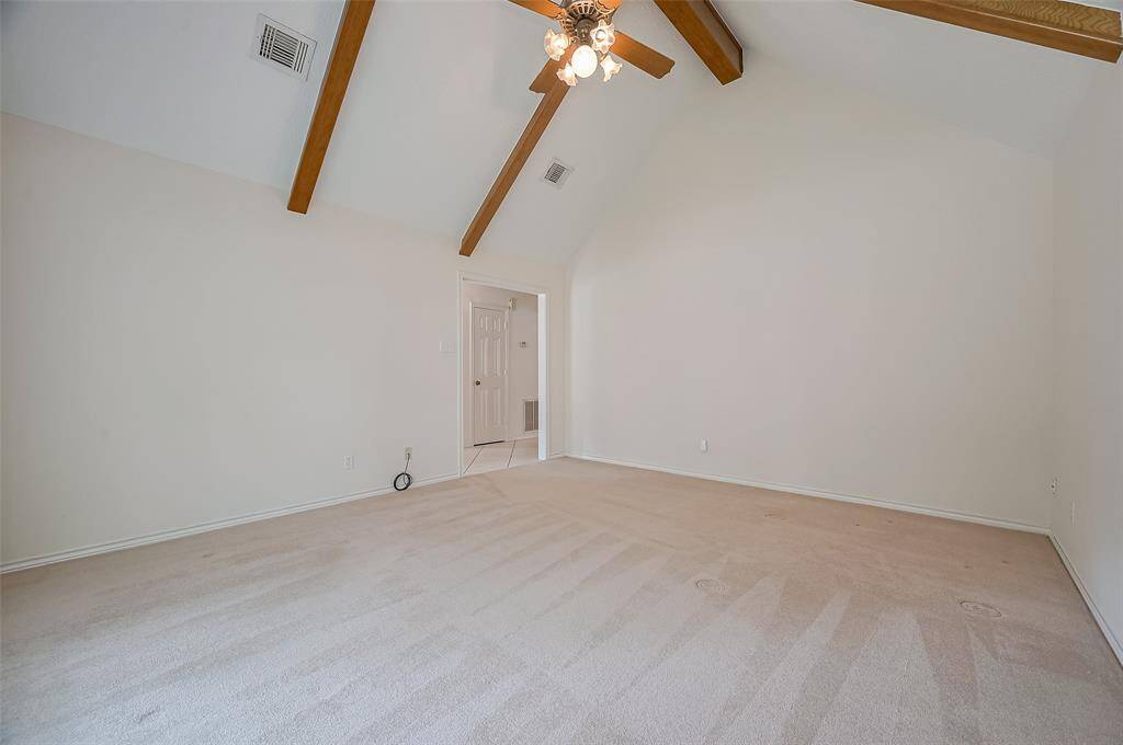 The living room offers fabulous wall space, making it a highly versatile area. Doors could easily be added off the foyer to create a quiet, private work area—perfect for working from home. The carpeted floor helps control noise, ideal for conference calls or Zoom meetings.