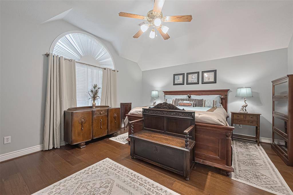 Primary bedroom retreat with high ceiling, extra storage, and private ensuite bath