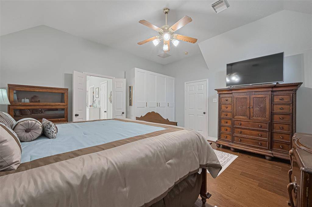 Primary bedroom retreat with high ceiling, extra storage, and private ensuite bath