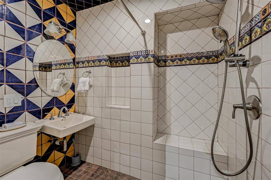First floor full bath with walk in shower designed with Talavera tile.