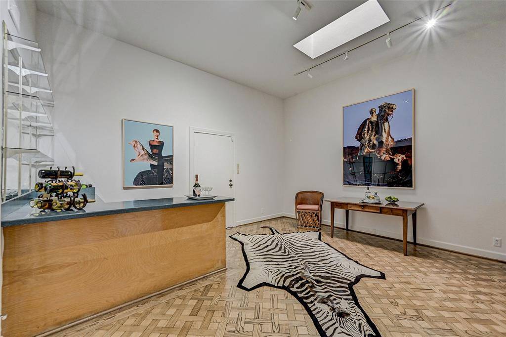 Spacious game room with a beverage bar just off den
