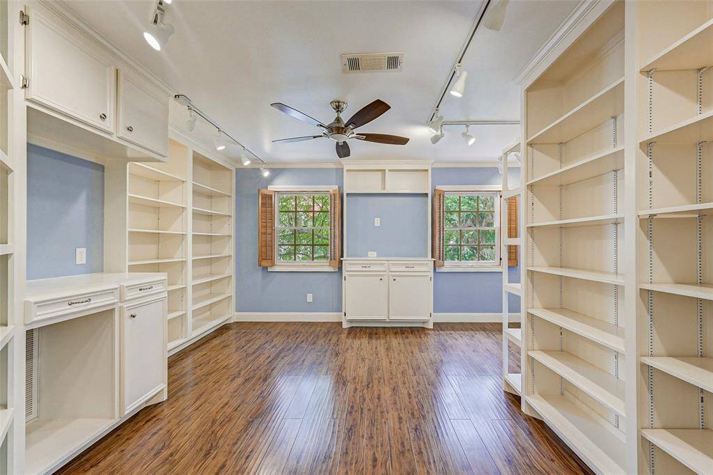 Bedroom with built in bookshelves galore. (17x15)