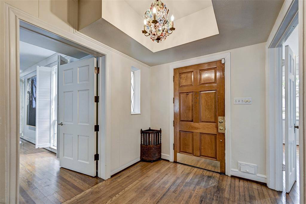 Upon entering the foyer guests are welcomed by rich hardwood floors