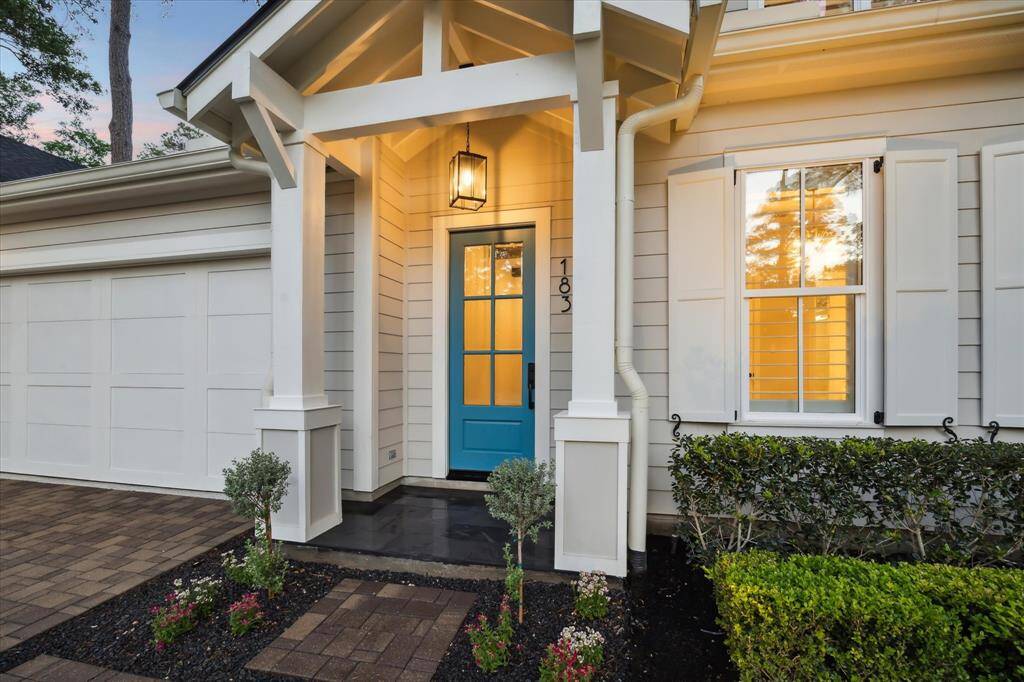 A painted blue front door with elegant glass panels sets the tone for this charming residence, offering a warm and inviting welcome to all who enter. Its cheerful hue adds a delightful pop of color, complementing the home's stunning architecture and enhancing its curb appeal. As sunlight dances through the intricate glass details, the entrance radiates a cozy sophistication, inviting guests to step inside and experience the beauty within. From the moment you arrive, this home makes a lasting impression.
