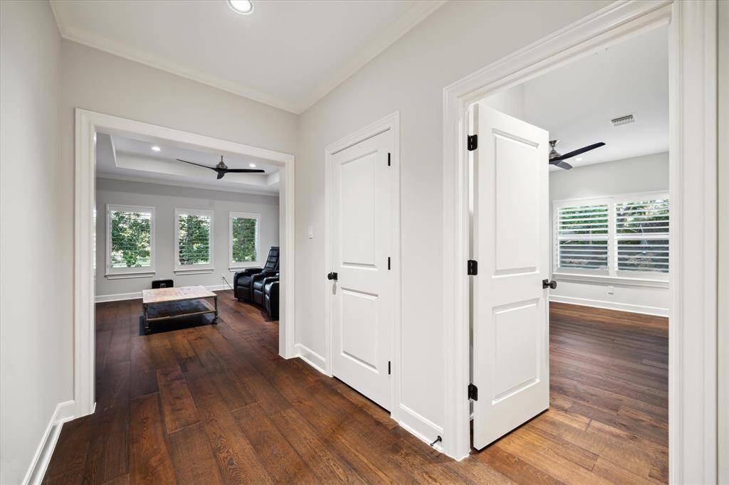 White trim and handsome white wooden doors adorn every room and passage in this home.