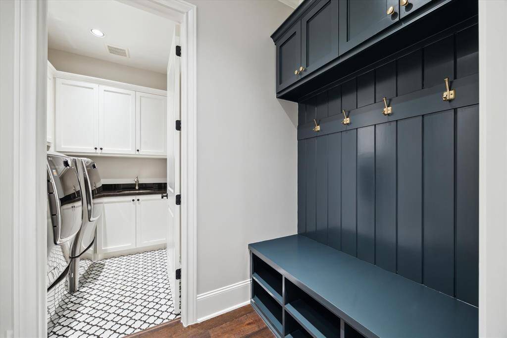 A thoughtfully designed laundry room and mudroom entry keeps everything looking organized and clean.
