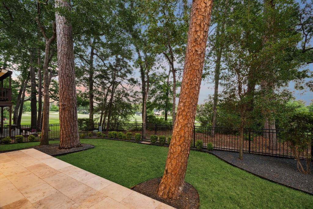 Tall mature trees provide privacy in the backyard with a protected view of the gorgeous Tournament Course.