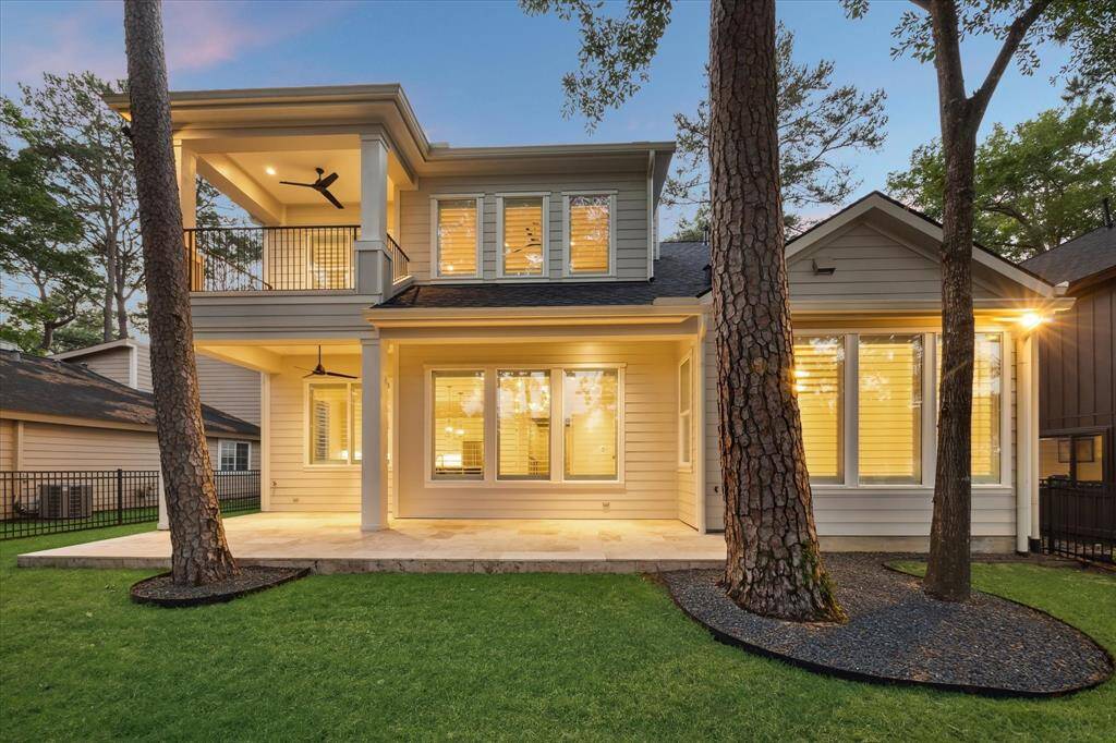 Covered porches on both the first and second floors create cool spaces to escape the bright Texas sun.
