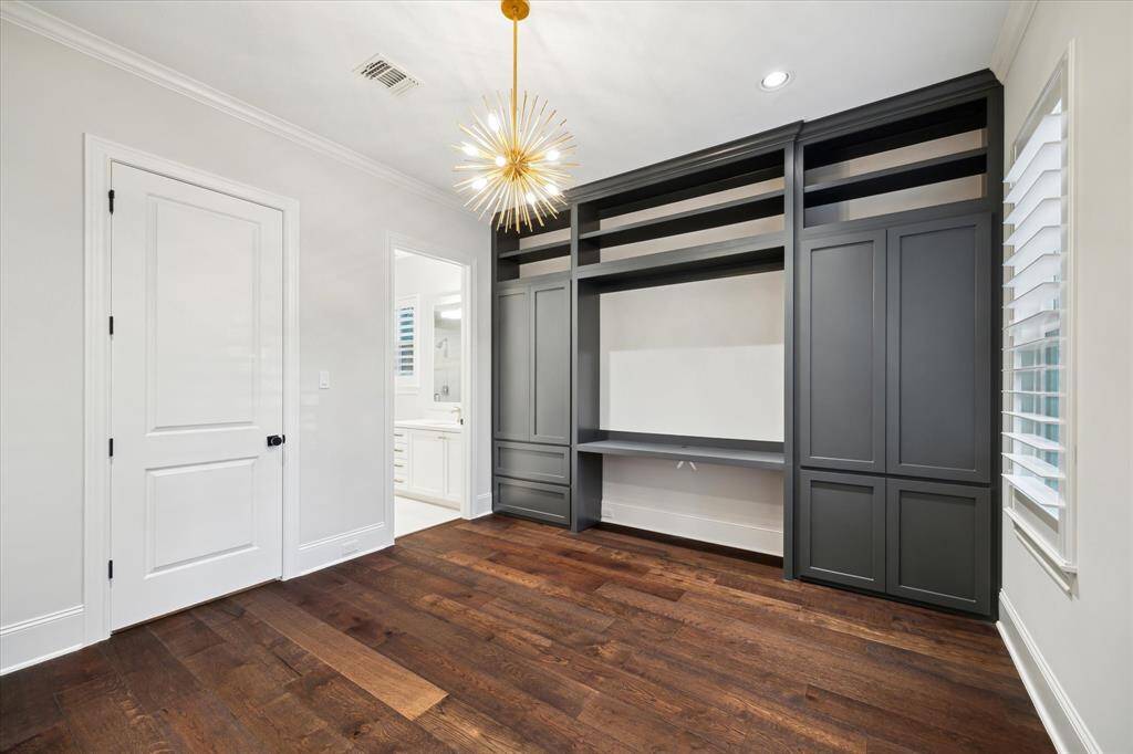 Working from home is a breeze in this handsomely appointed home office space.