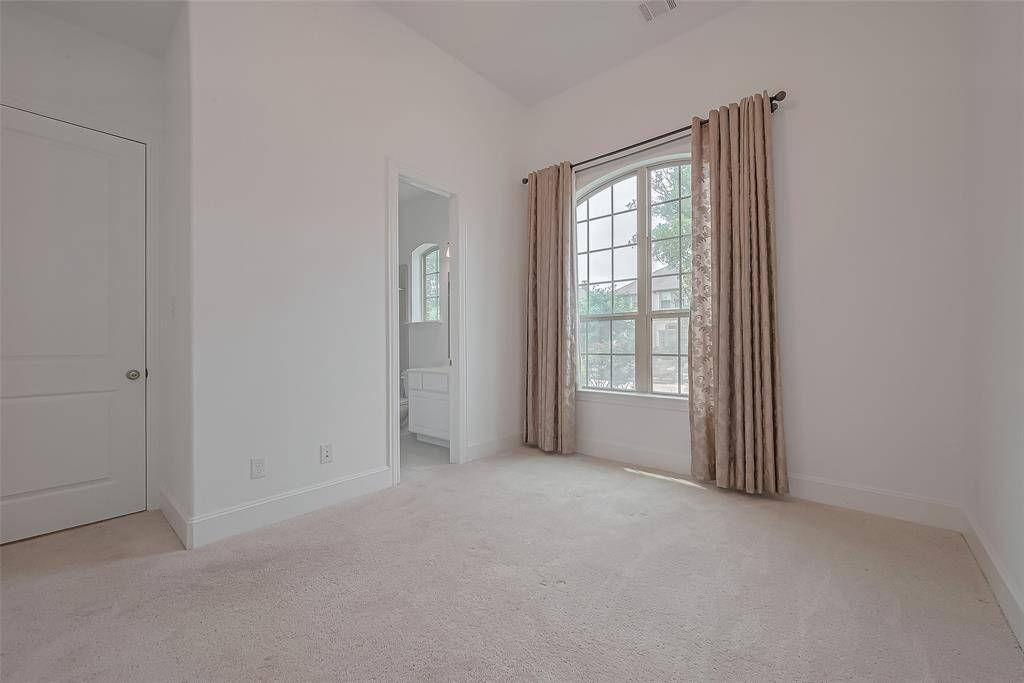 Downstairs guest bedroom with a private full bathroom.