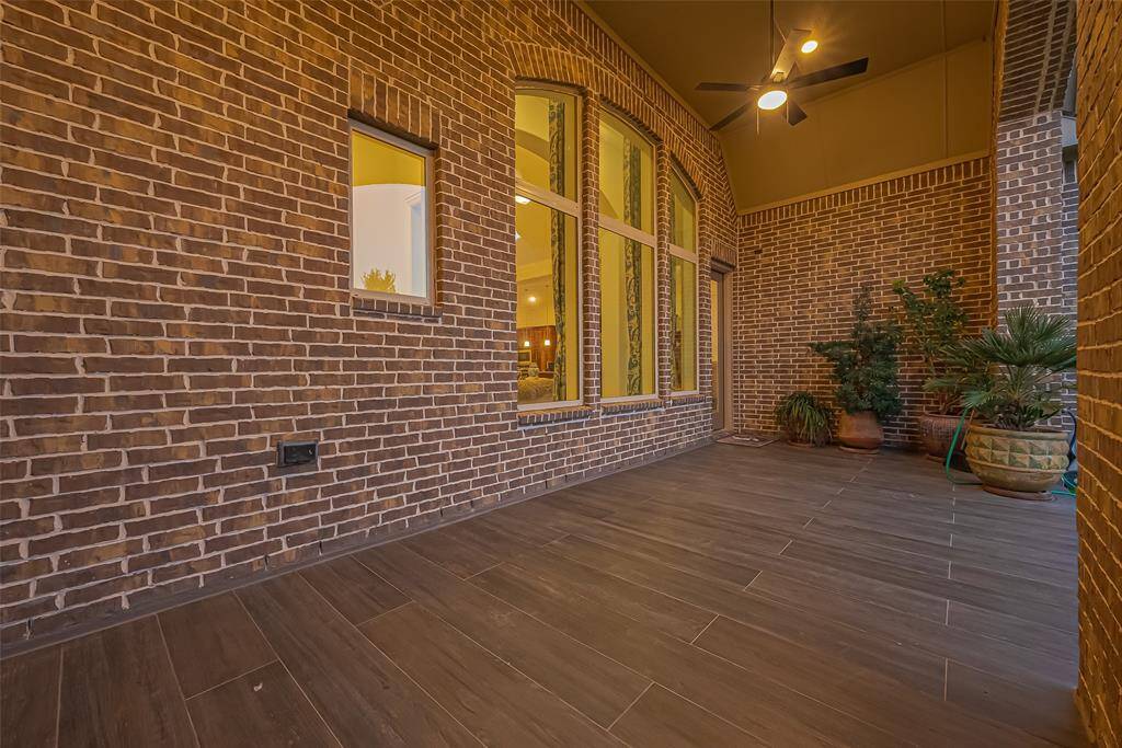 Large covered patio with tile pavers. Gas stub for cooking outside!