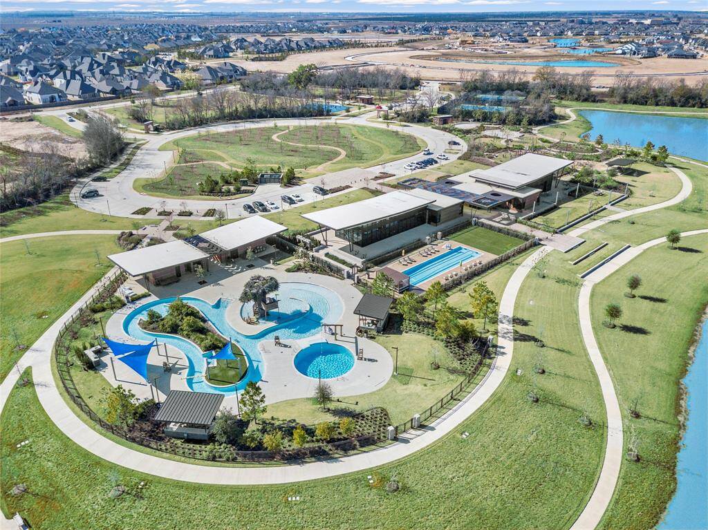 Residents can enjoy a game of tennis just steps away from the sparkling pools, combining recreation and relaxation in a picturesque setting.
