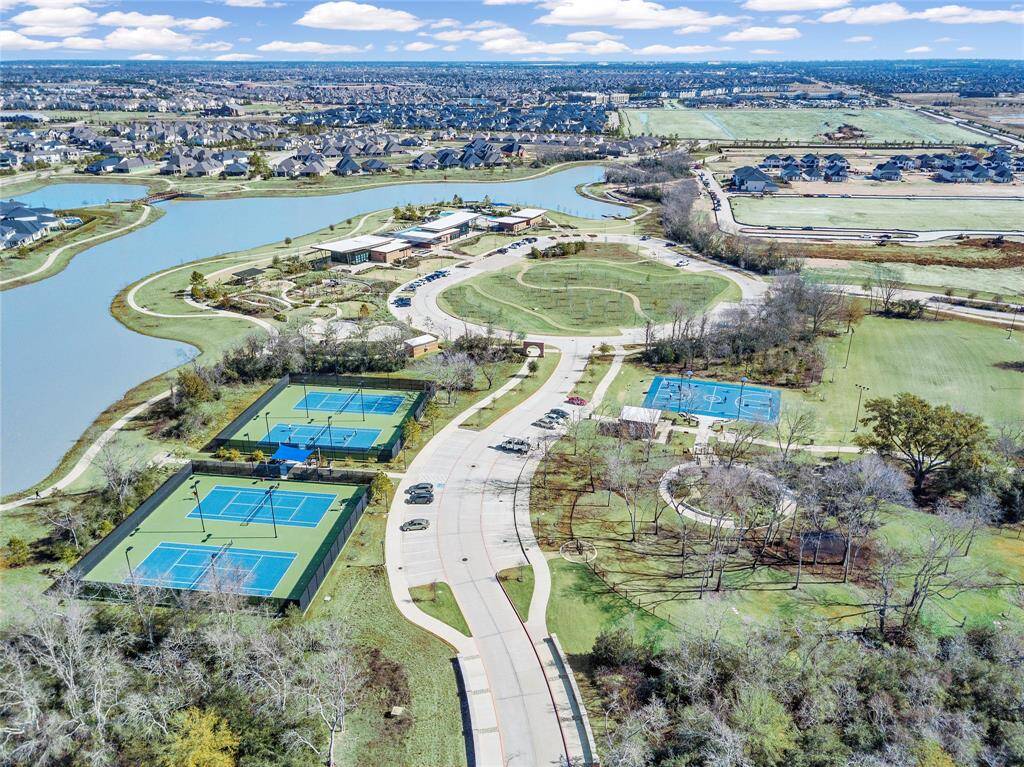 Residents can enjoy a game of tennis just steps away from the sparkling pools, combining recreation and relaxation in a picturesque setting.