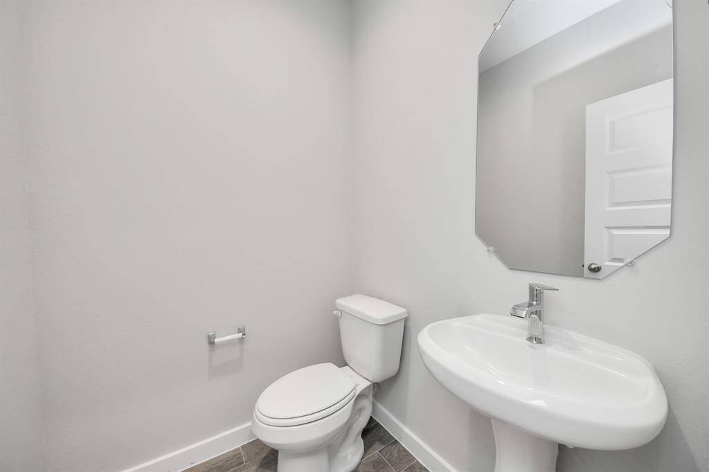 Half bathroom.Sample photo of completed home with similar plan. Actual colors and selections may vary. Call for more info.