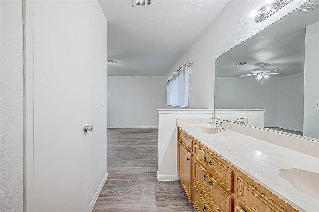 Primary back looking toward bedroom. Door to walk in closet on left