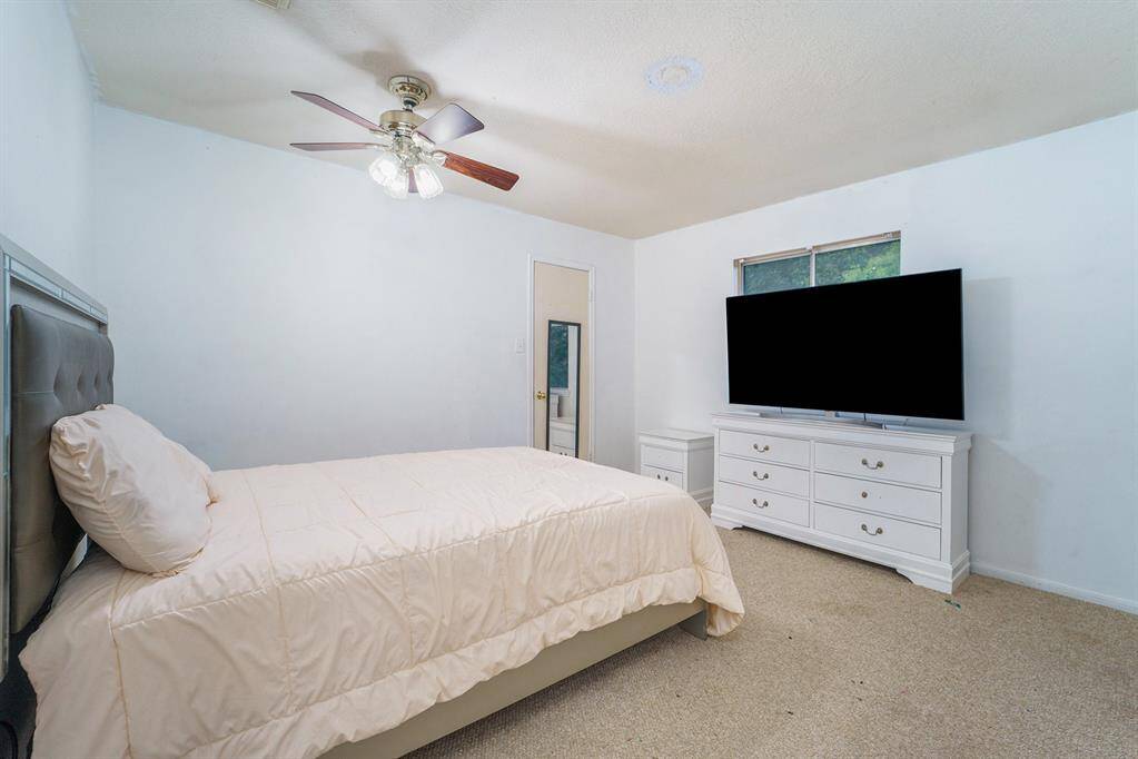Secondary bedroom with a large walk-in closet.