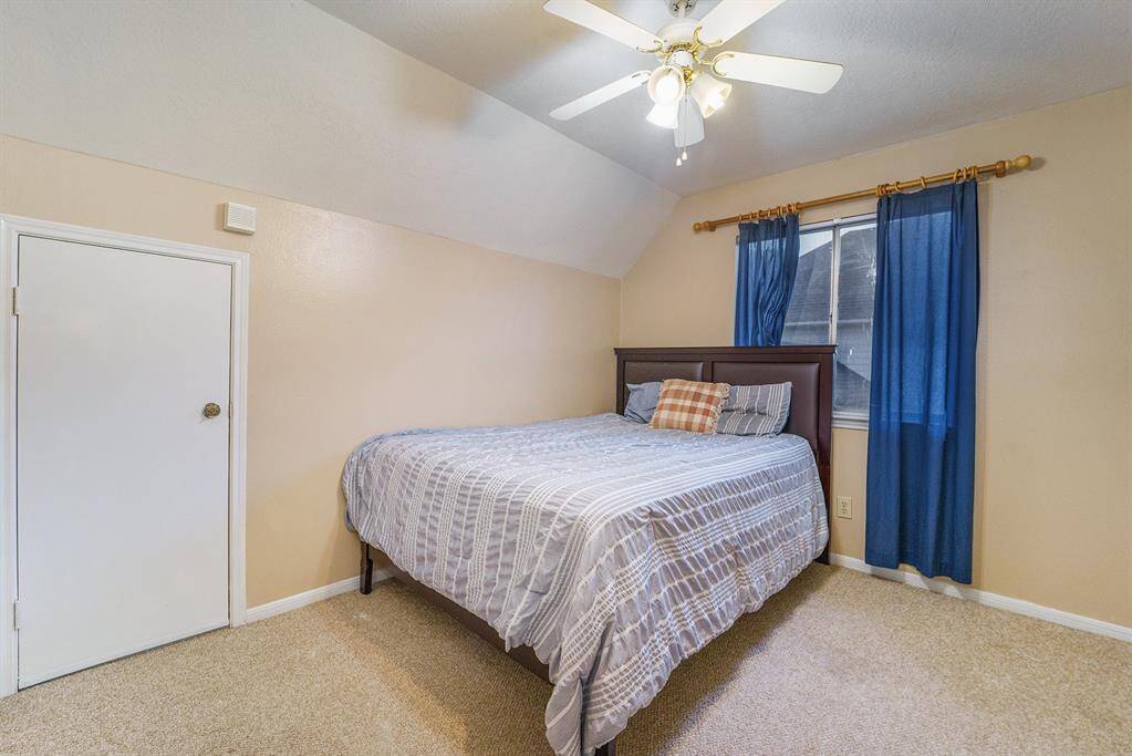 Additional secondary bedroom with high ceilings and a huge walk-in closet.