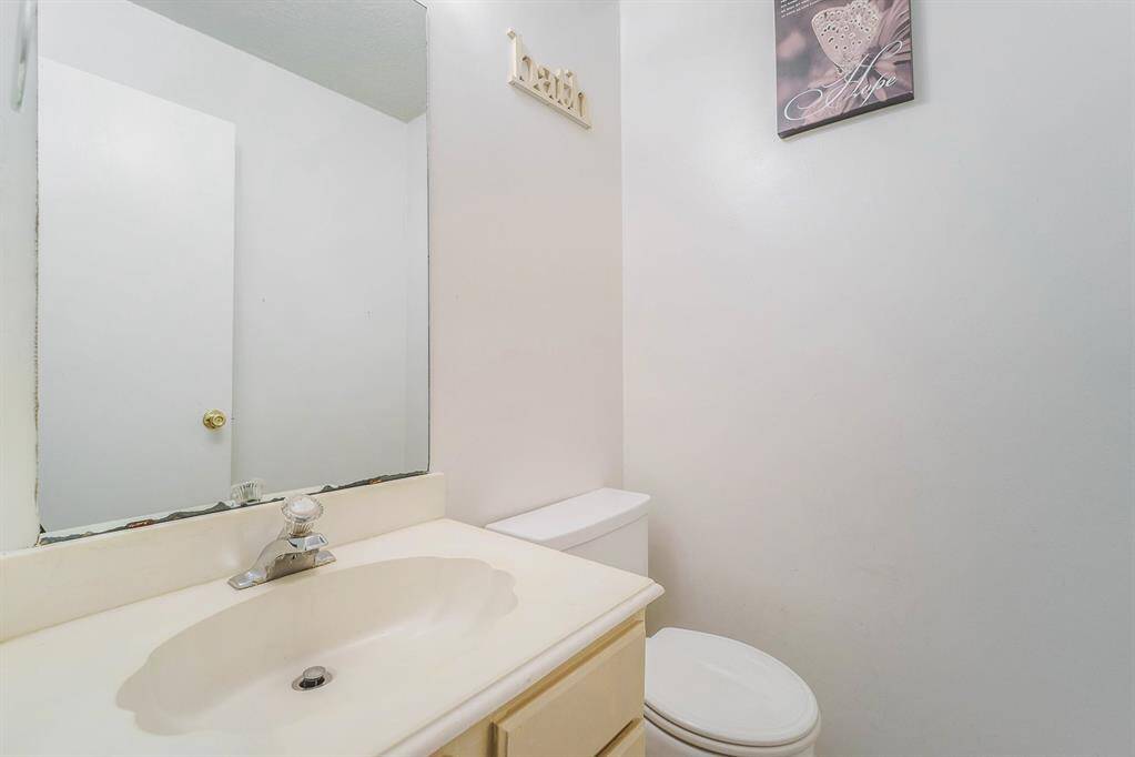 This Half bath is conveniently located next to the living room.