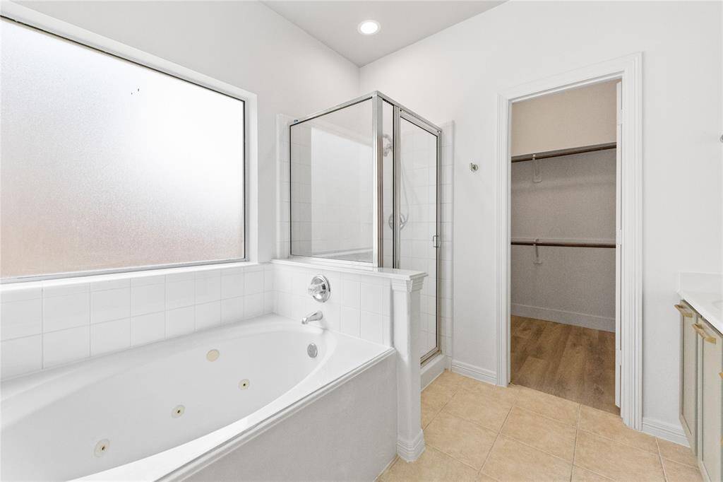 Primary Bathroom with walk-in shower and spa jet tub