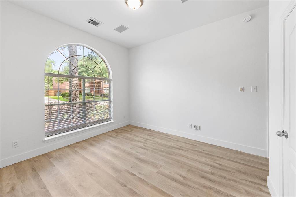 Front flex room with oversized windows and built in speakers
