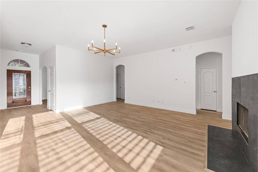 Family Room with engineered flooring and center chandelier