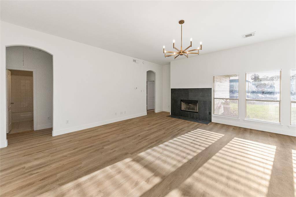 Family Room with large black tiled fireplace
