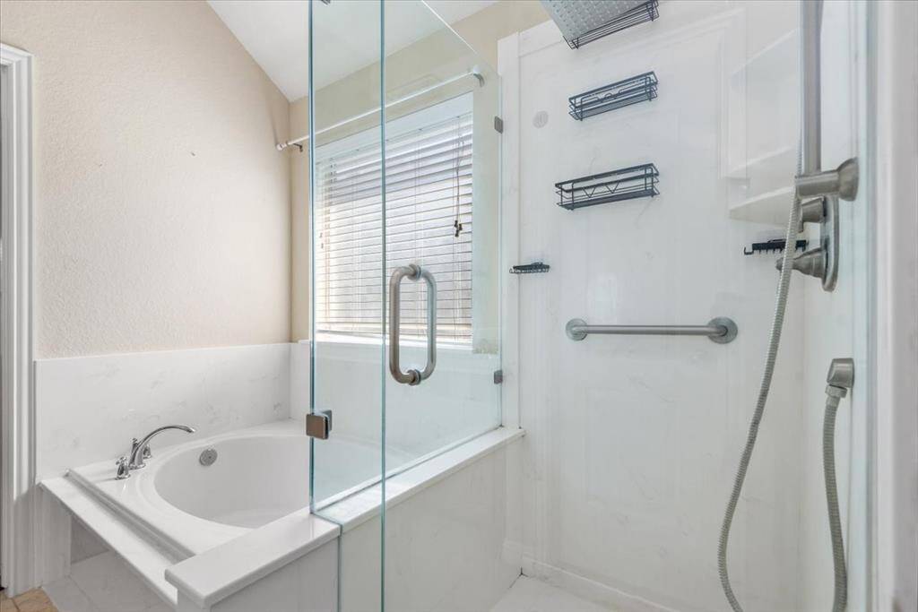Separate tub and shower in primary bathroom