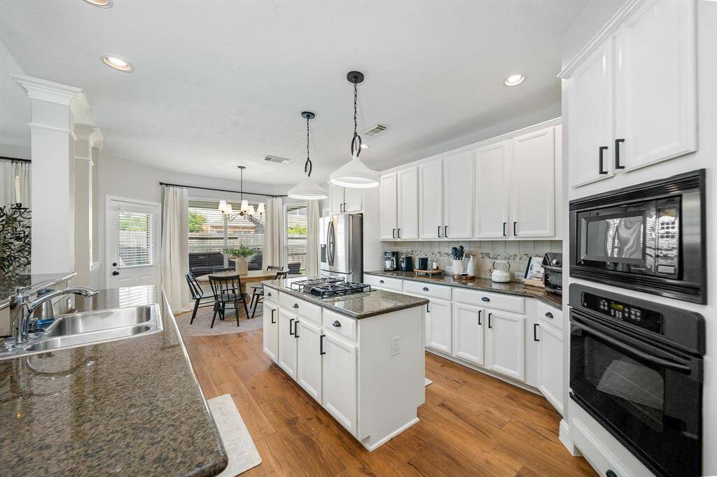 Kitchen opens up to breakfast nook