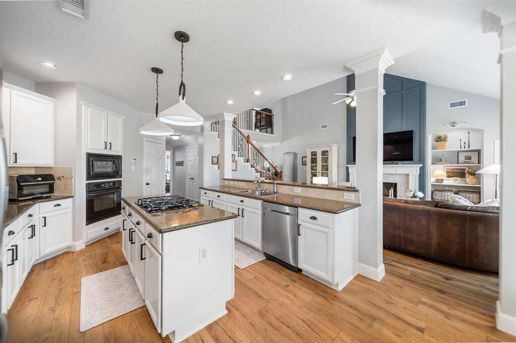 Kitchen opens up to living room and breakfast nook