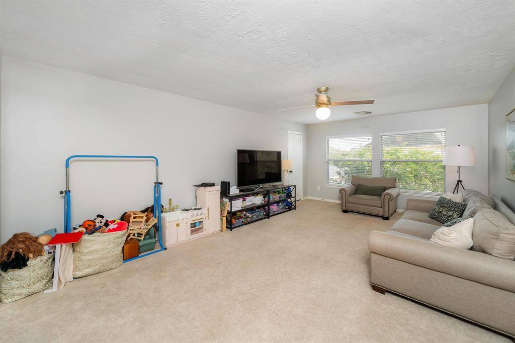 Upstairs game room with lots of attic storage!