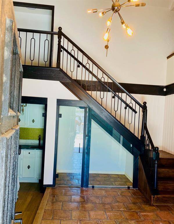 Stairway with wine room underneath
