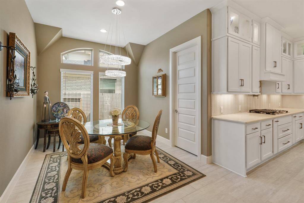 Charming breakfast nook just off the kitchen, featuring beautiful windows and convenient access to the laundry room.