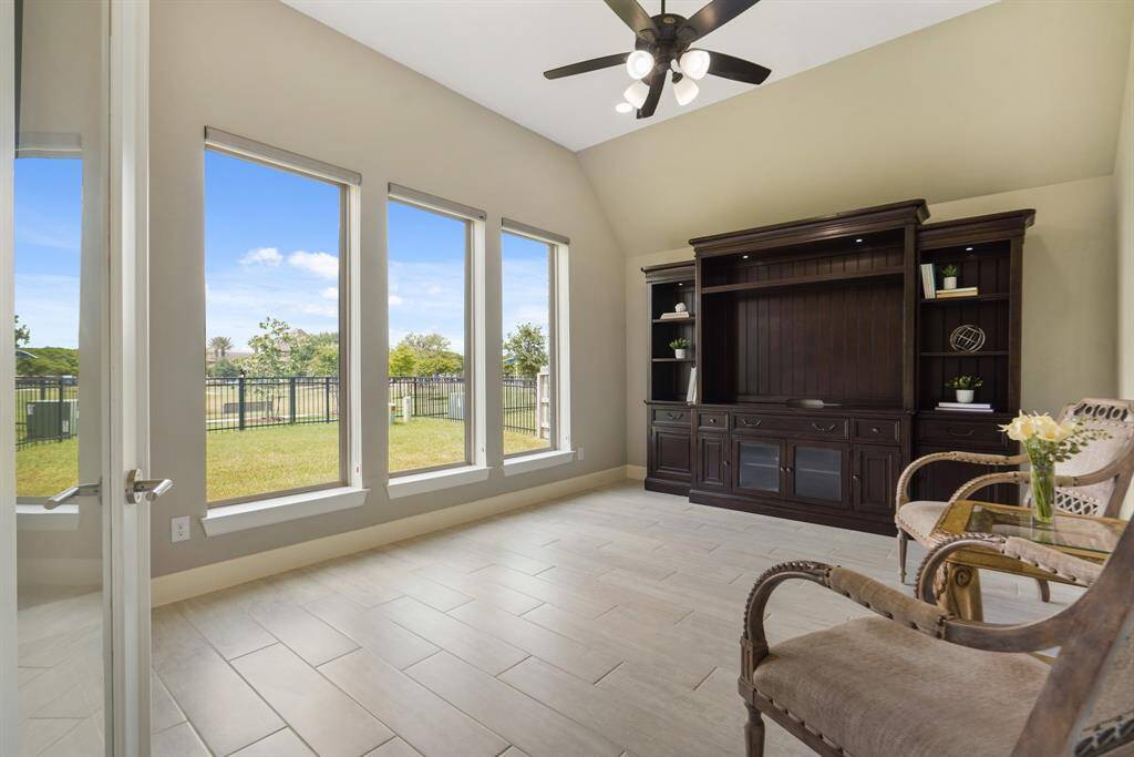 The second flex room complete with glass paneled doors, and bathed in natural light, offers endless possibilities that can be suited for work, a fitness room, or relaxation.
