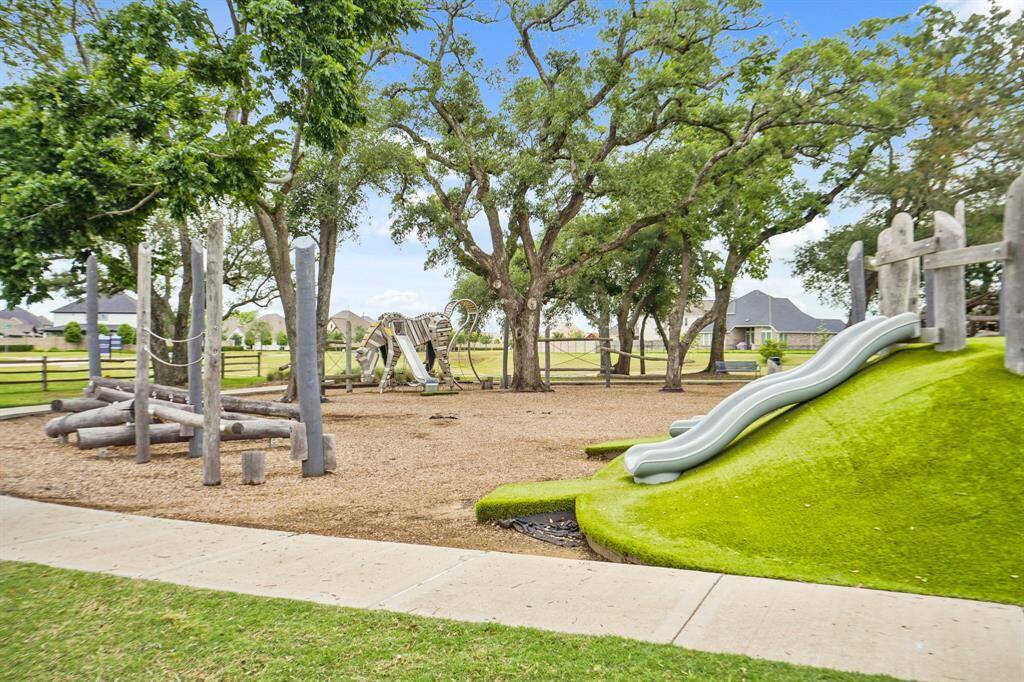 One of the tree-shaded playgrounds where swings, slides, and play equipment invite carefree afternoons.